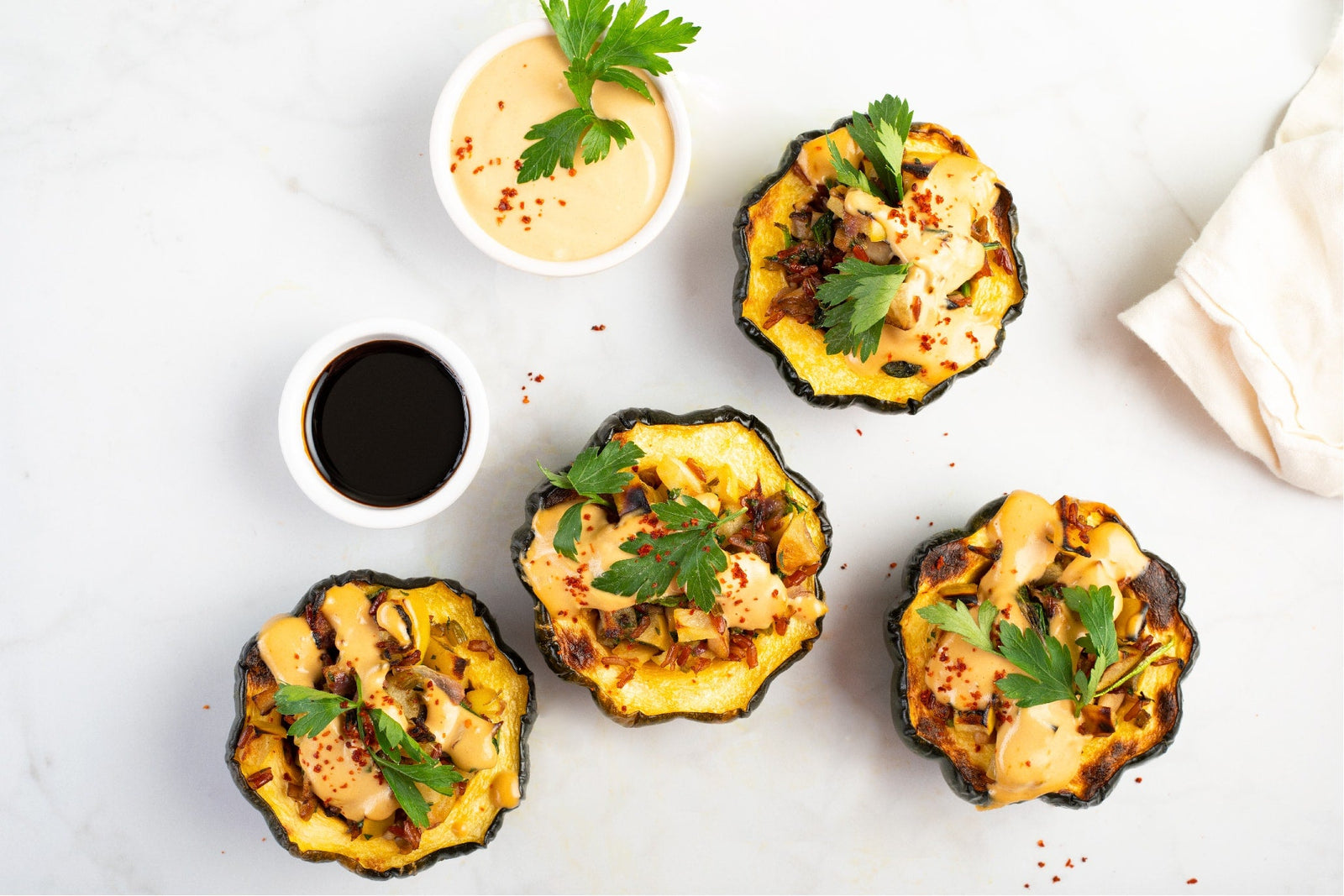 Stuffed Acorn Squash with Tahini Pomegranate Sauce