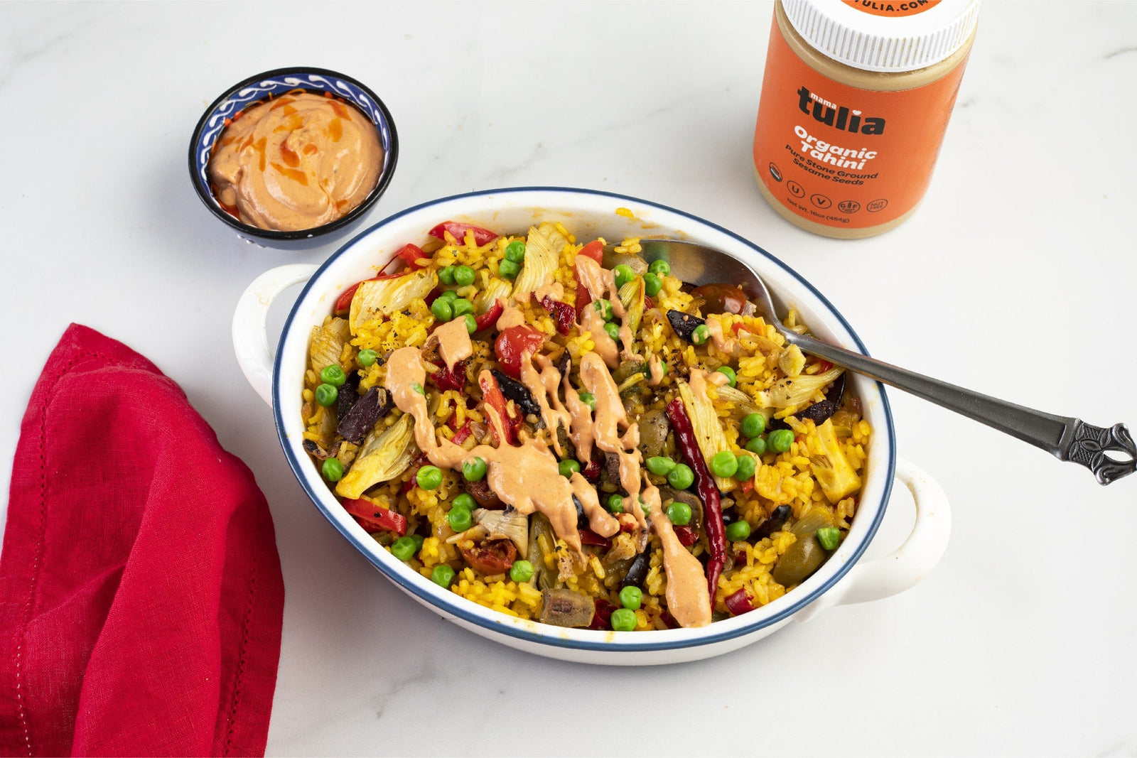 Fennel, Tomato, and Olive Paella with Tahini Tomato Sauce
