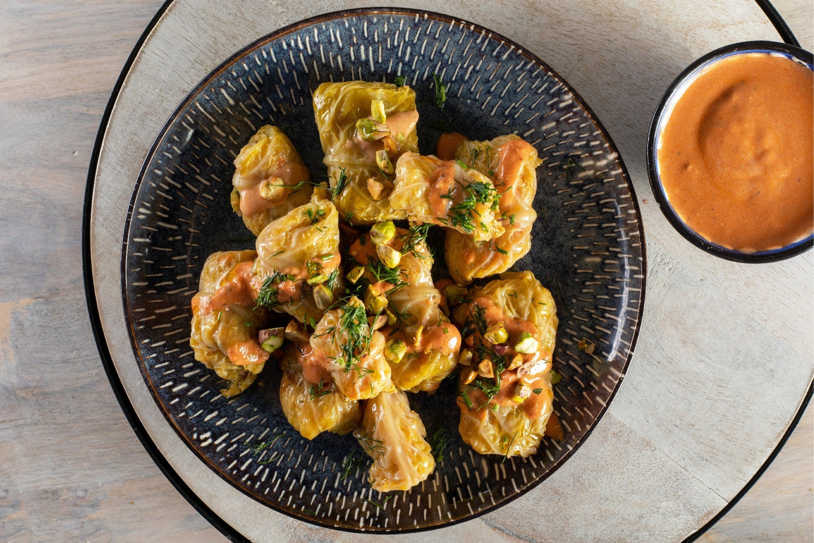 Cabbage Rolls with Tahini Tomato Sauce